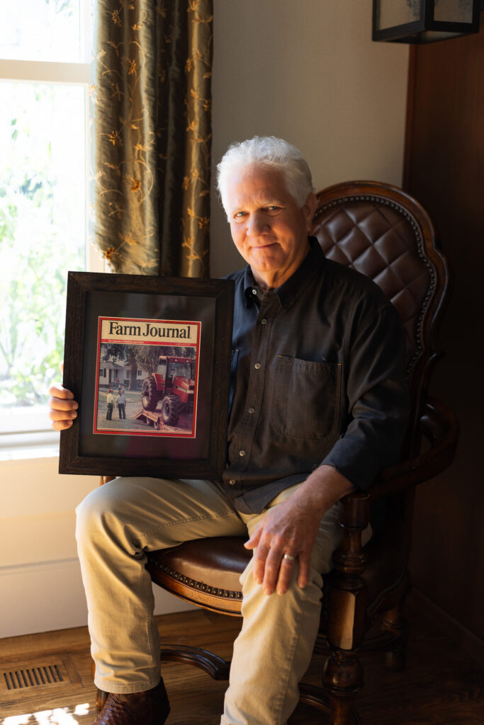 Steve Hageman holding a framed Farm Journal cover