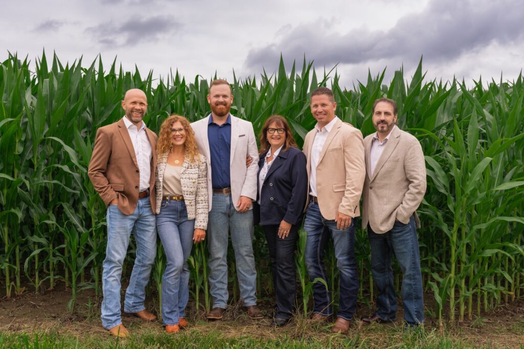 brokers in front of corn